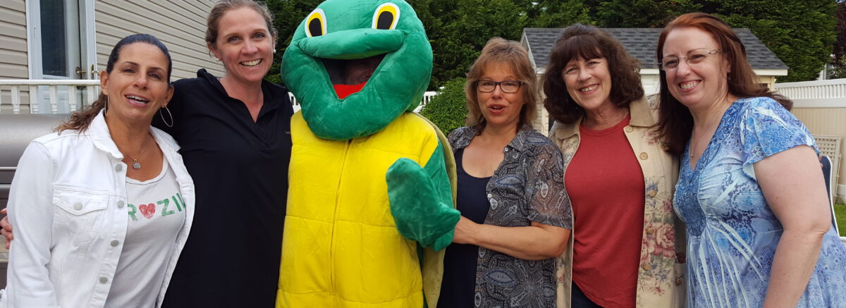 Fran Spencer with Sassy the Turtle and other Board members