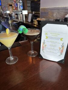 A tiny toy turtle tries a martini