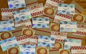 An array of Amazon gift cards with holiday themes