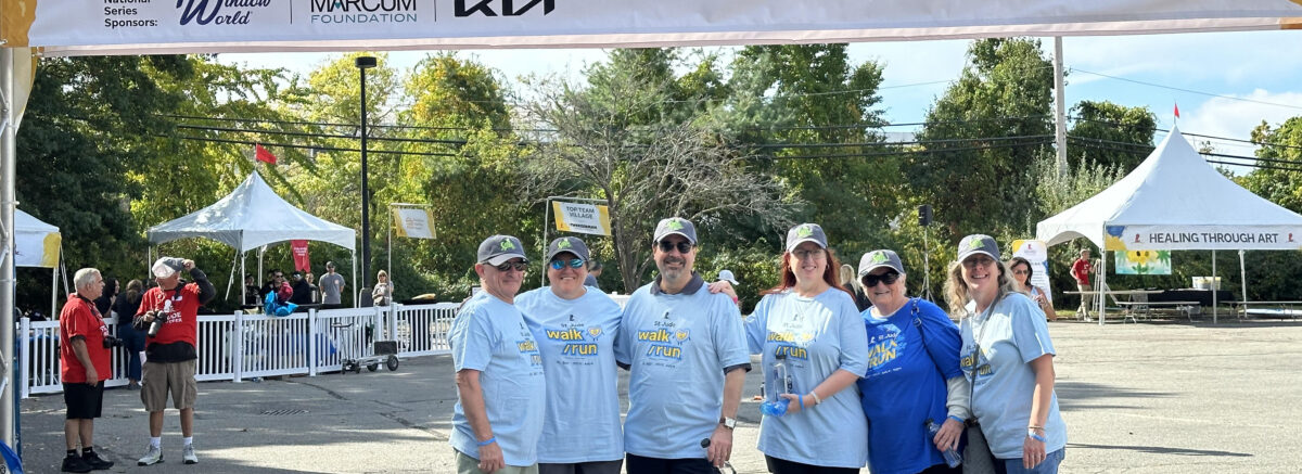 Team Spencer smiles triumphantly at the finish line