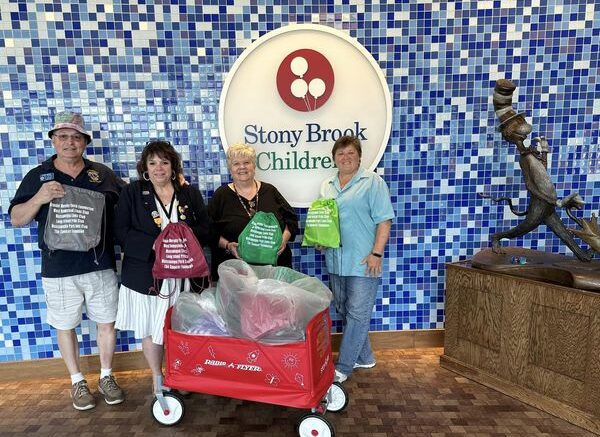 Jeanine Spencer together with members of the Brandel Murphy Foundation and the Lions deliver gift bags to Stony Brook Children's Hospital