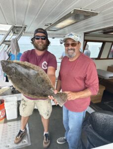 Captain Zach assures a lucky angler that he's got a keeper