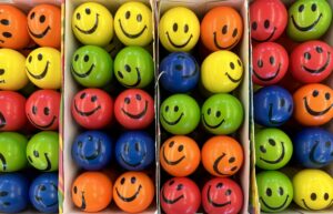 Brightly colored stress balls with smiling faces