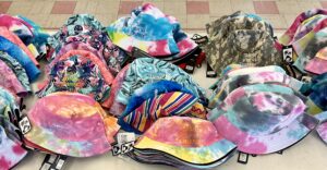 An assortment of bucket hats in an array of colors and patterns