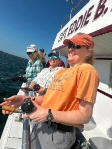 Anglers deploy their poles, waiting for a fish to take the bait