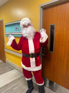 Santa making a surprise visit at the pediatric cancer care ward at Stony Brook Children's Hospital