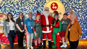 Santa, elves and Jeanine Spencer with Joan Alpers and the Child Life staff at Stony Brook Children's Hospital